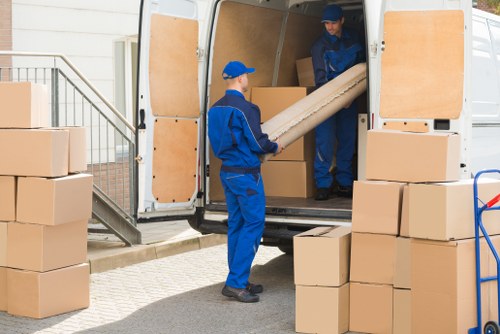 Professional movers handling furniture in Edgware storage
